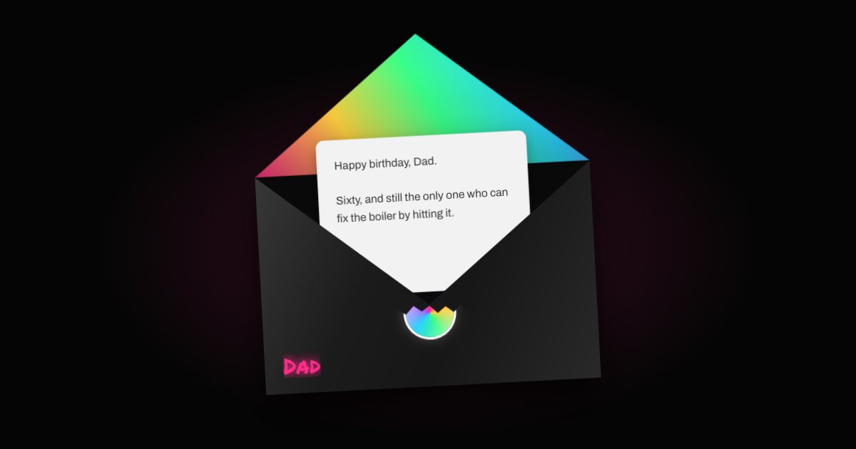 A black envelope with a rainbow neon lining, open, with a letter beginning “Happy birthday, Dad”