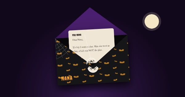 A black envelope with orange bats, open, with a letter to Nana beginning “It’s Ivy. I went as a bat”